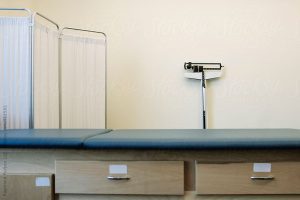 patient bed and scale in doctor's office