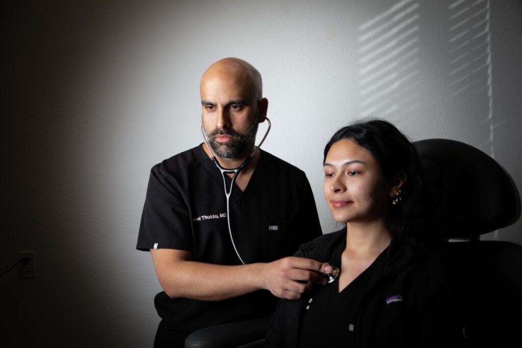 A caring medical professional discussing treatment options with a patient at TRTMD Clinic